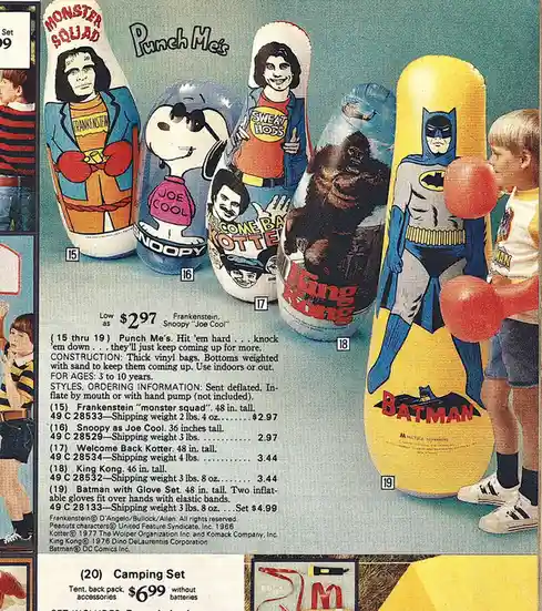 A vintage toy catalog page displays a row of inflatable punching bags featuring characters like Frankenstein, Snoopy as Joe…