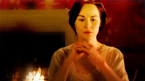 A six-panel image sequence shows a woman in a period dress standing before a fireplace, her hands clasped. In the top row…