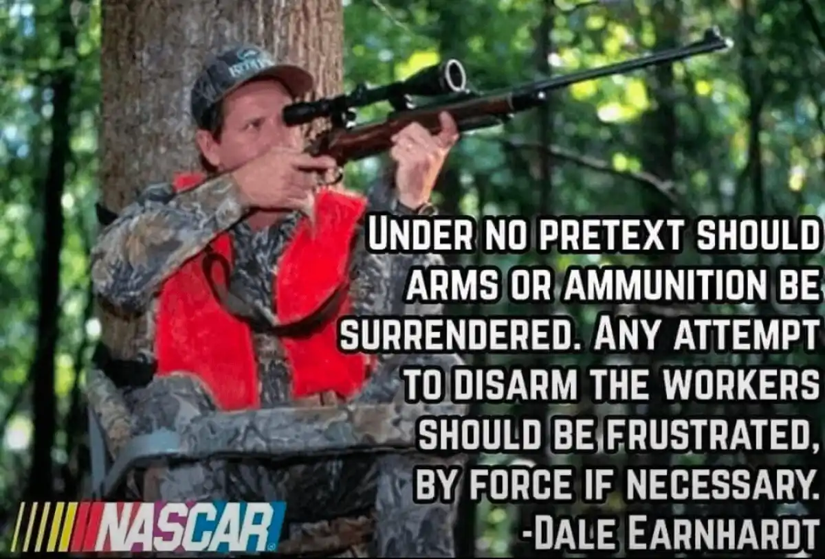 A man in camouflage clothing and a red hunting vest is aiming a scoped rifle from a tree stand in a forest. Overlaid text…