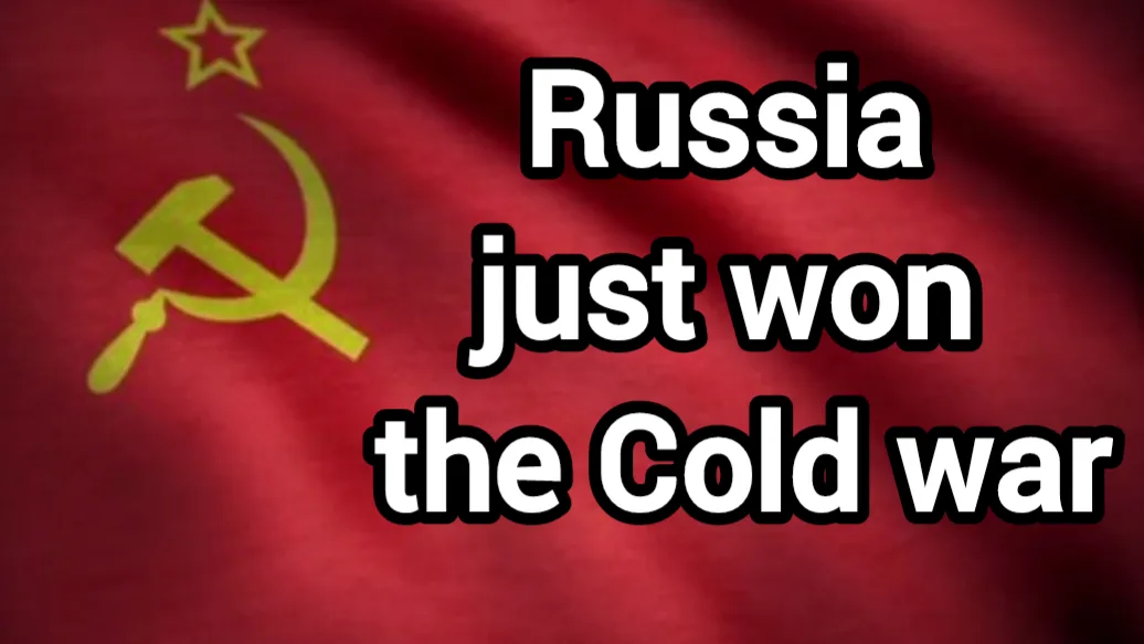 The image displays the red flag of the former Soviet Union, featuring a yellow hammer and sickle emblem with a star above…