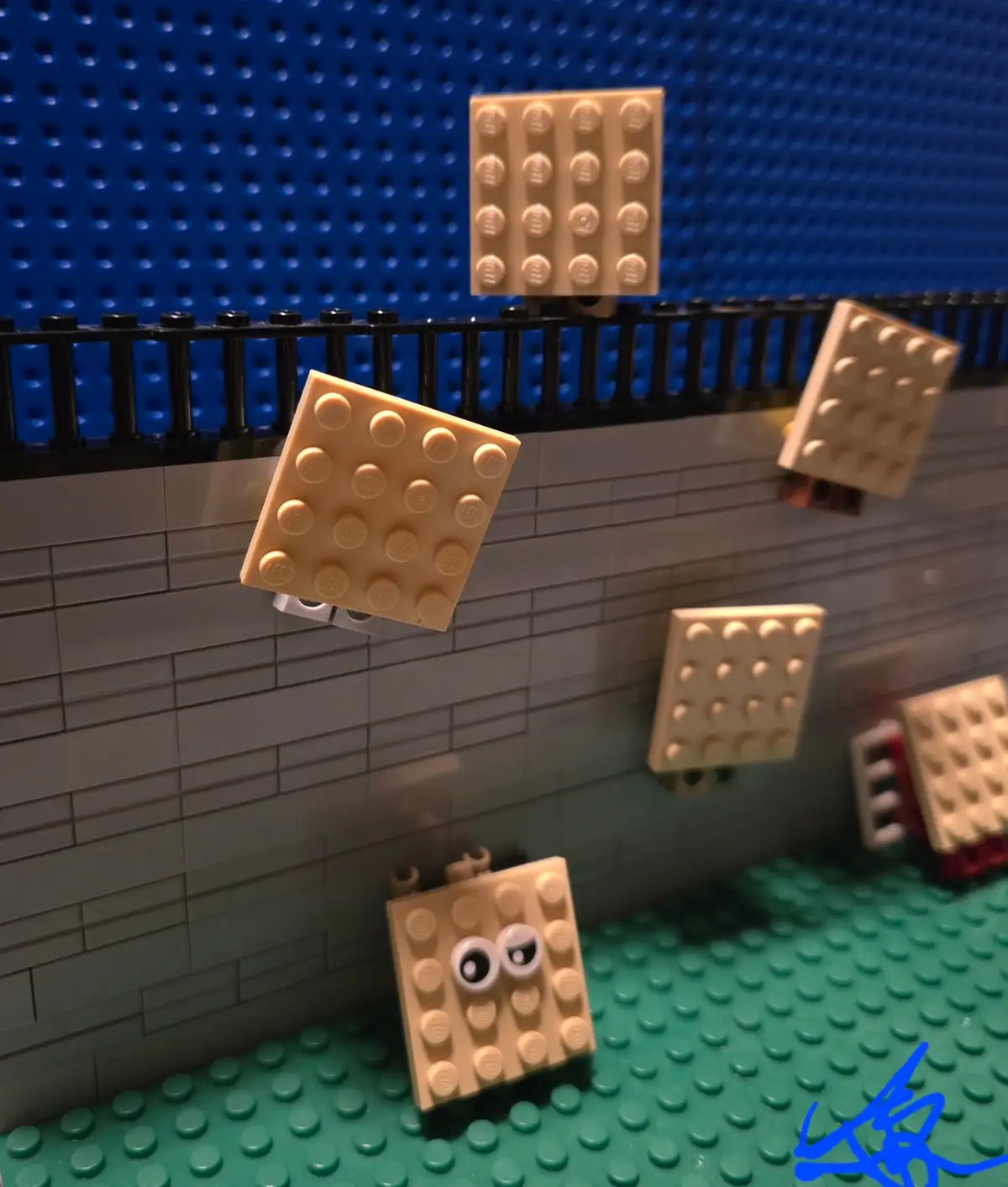 A photo of beige LEGO bricks arranged to look like they are falling or floating in mid-air against a LEGO-built background…