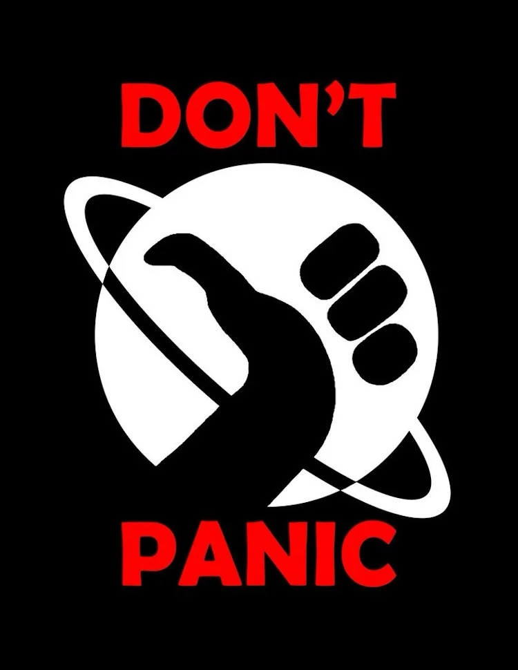 A black background features the iconic 'Don't Panic' logo from Douglas Adams' 'The Hitchhiker's Guide to the Galaxy'…