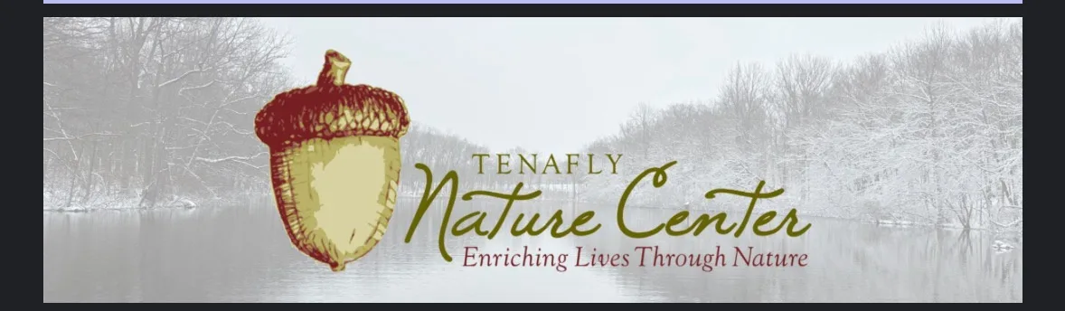 A banner image for the Tenafly Nature Center features a large illustrated acorn logo on the left, set against a snowy winter…