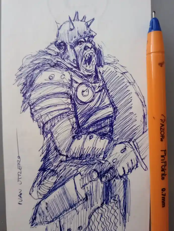 A blue ink sketch on white paper depicts a fierce, spiky-helmeted orc-like warrior in armor, holding a weapon, with the…