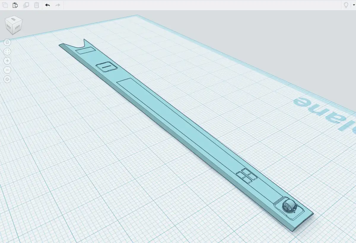 A 3d modeling software interface displays a long, light-blue, abstract object with cutouts and a small spherical component…