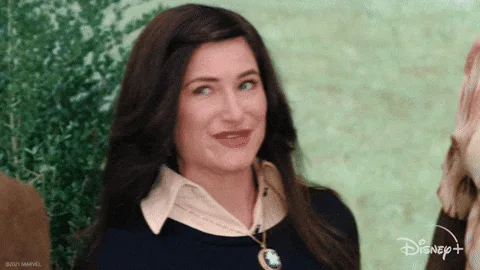 A six-panel image sequence shows a woman with long dark hair wearing a dark blue top with a light-colored collar and a…