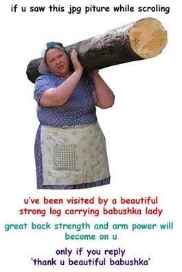 A woman wearing a blue patterned shirt and a white apron with a red and white checkered pattern is carrying a large log on…