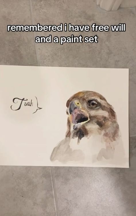A watercolor painting of a bird, likely a hawk or falcon, is shown lying on a tiled floor. The bird's head is turned…
