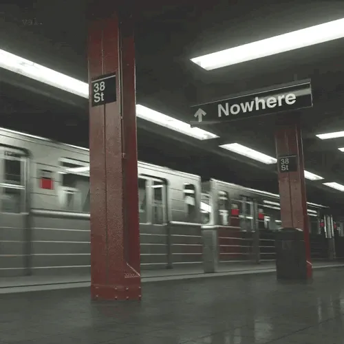 A subway station scene with a sign that reads 'Nowhere' above an arrow pointing up, while a train blurs past in the…