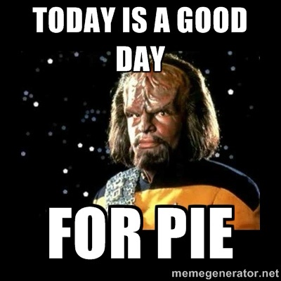 A close-up of the Star Trek character Worf in his yellow and black uniform, set against a starry black background. Large…