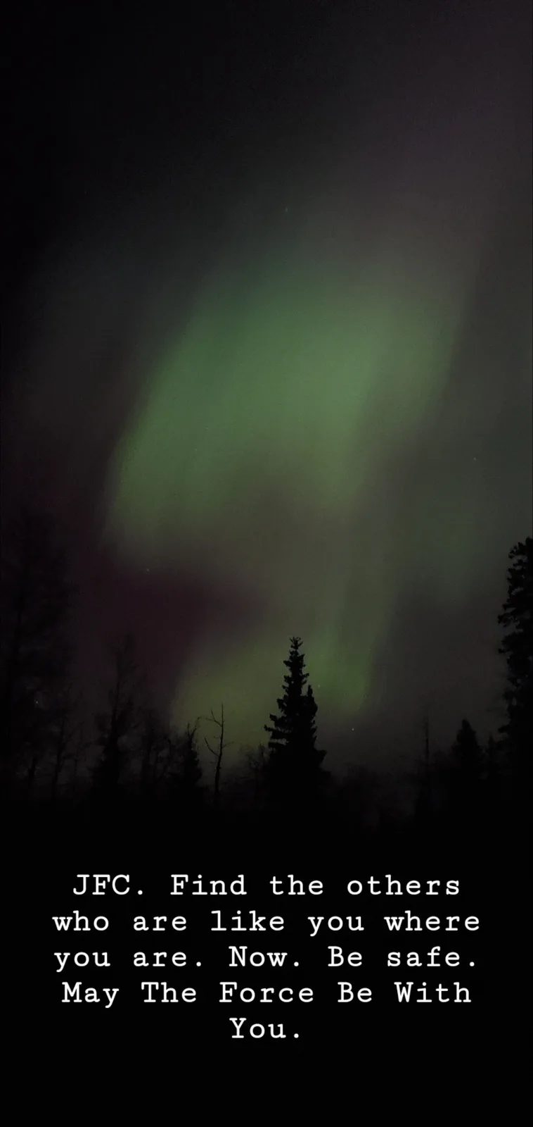 A dark forest silhouette under a night sky displaying a vibrant green aurora borealis. White text at the bottom reads: 'JFC…
