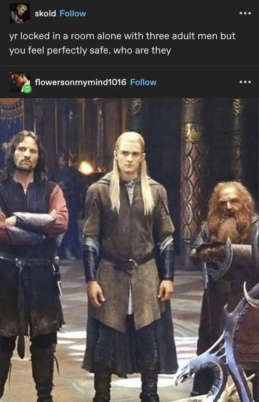 The image shows three male fantasy characters standing in a room: a man with long dark hair and arms crossed, a man with…