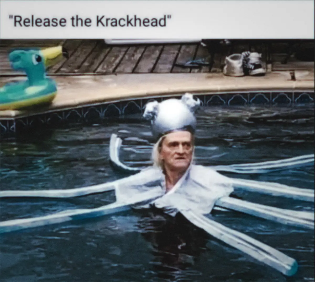 A man with long blonde hair is in a swimming pool wearing a silver, octopus-like costume with long tentacles extending…