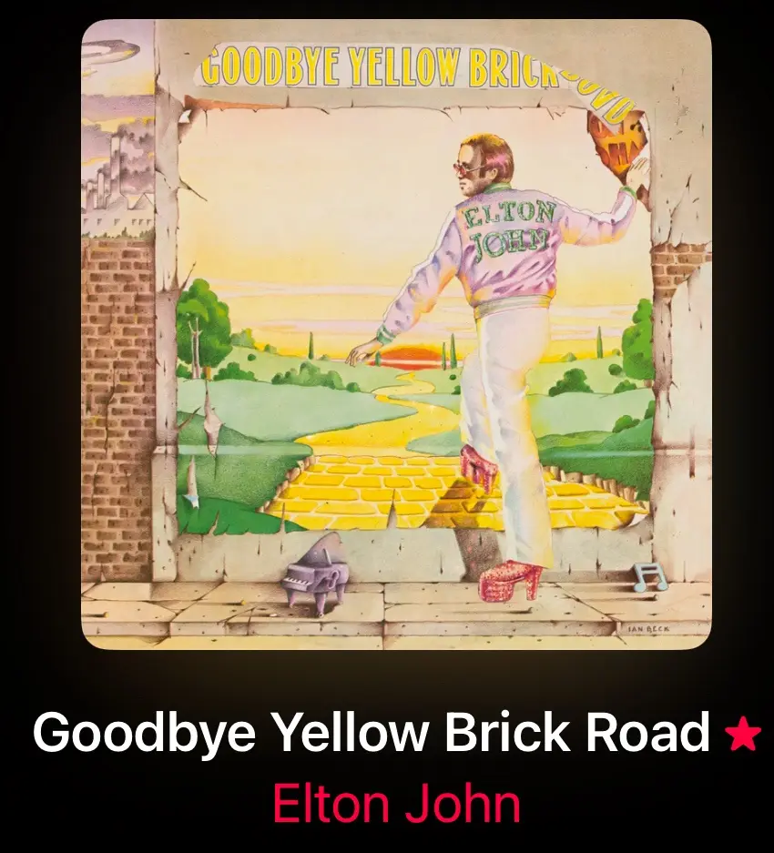 An illustrated album cover shows Elton John in a purple jacket with his name on the back, wearing red platform shoes…