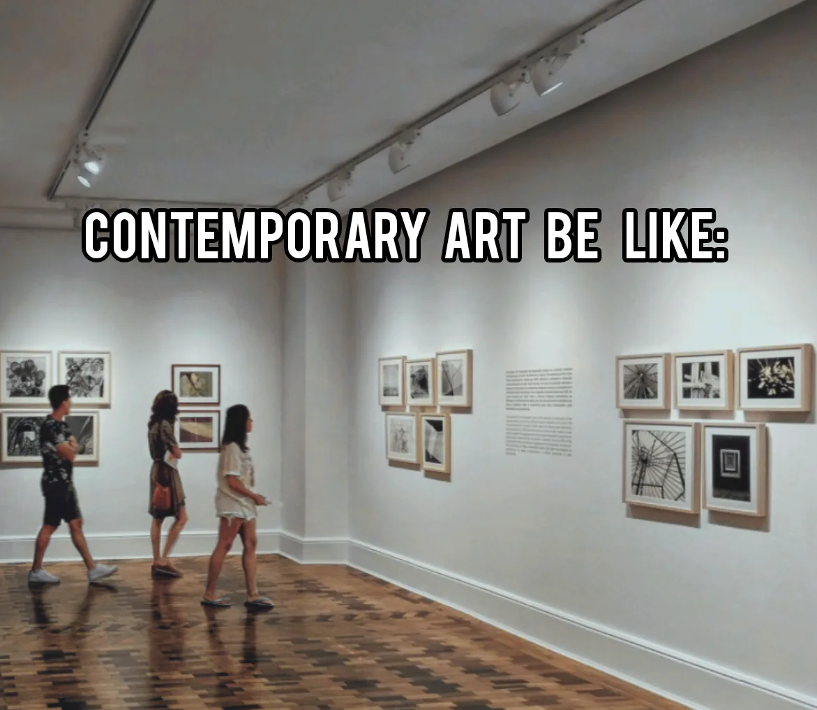 Three people walk through a well-lit art gallery with white walls and wooden floors, observing framed black-and-white…