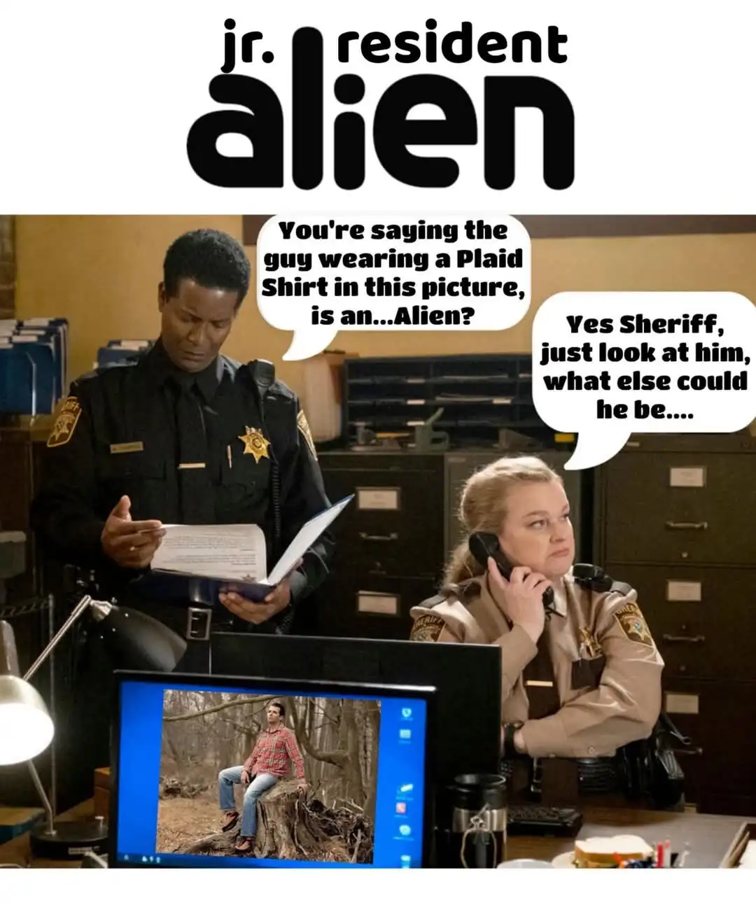 Two police officers in a sheriff's office are reacting to a photo on a computer monitor showing a man in a plaid shirt…