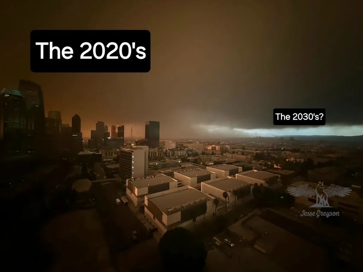 An aerial view of a city skyline under a hazy, orange-brown sky, with a black text box in the upper left reading 'The…