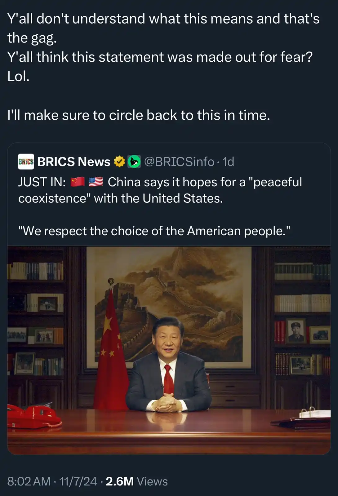 The image shows a man in a suit sitting at a desk with a Chinese flag and a painting of the Great Wall behind him. Overlaid…