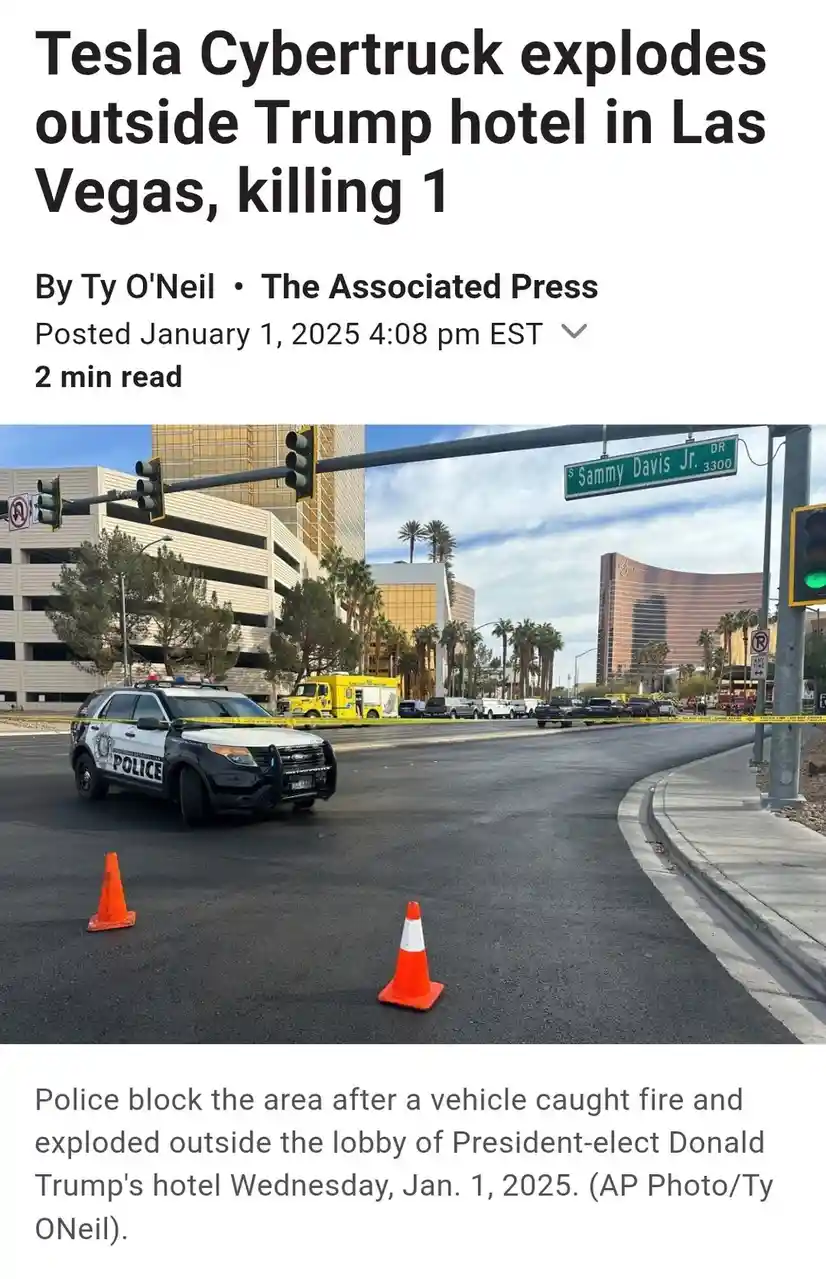 An image of a police car parked on a street corner near a 'Sammy Davis Jr. DR' street sign, with orange traffic cones and…
