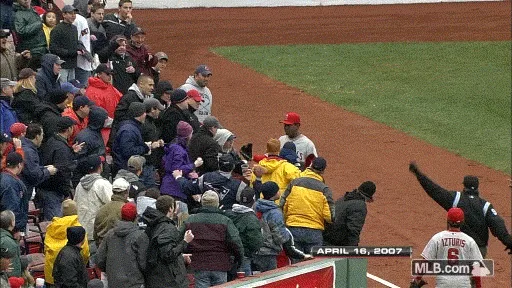 a sequence of images from a baseball game on april 16, 2007, showing a fan getting hit in the face with a foul ball, then…