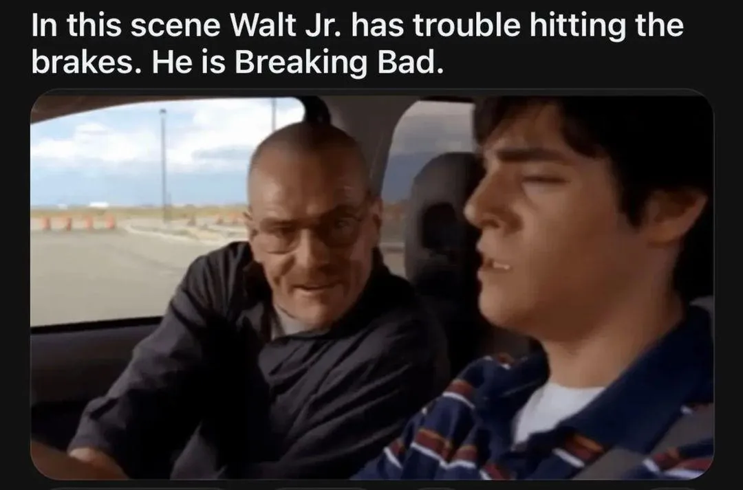 A still from the TV show 'Breaking Bad' shows two men in a car. The driver, Walt Jr., has his eyes closed and appears to be…