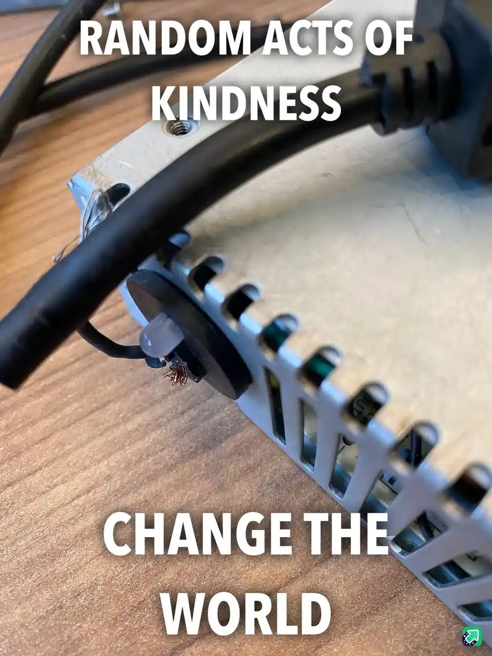 A close-up photo of a damaged electronic component, likely a motor or gear, with exposed copper wires and a broken plastic…