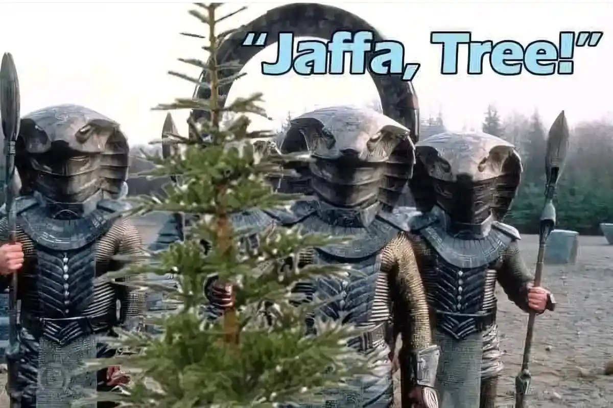 Three Jaffa warriors from Stargate SG-1 stand in a row, looking at a small evergreen tree in front of them. The overlaid…