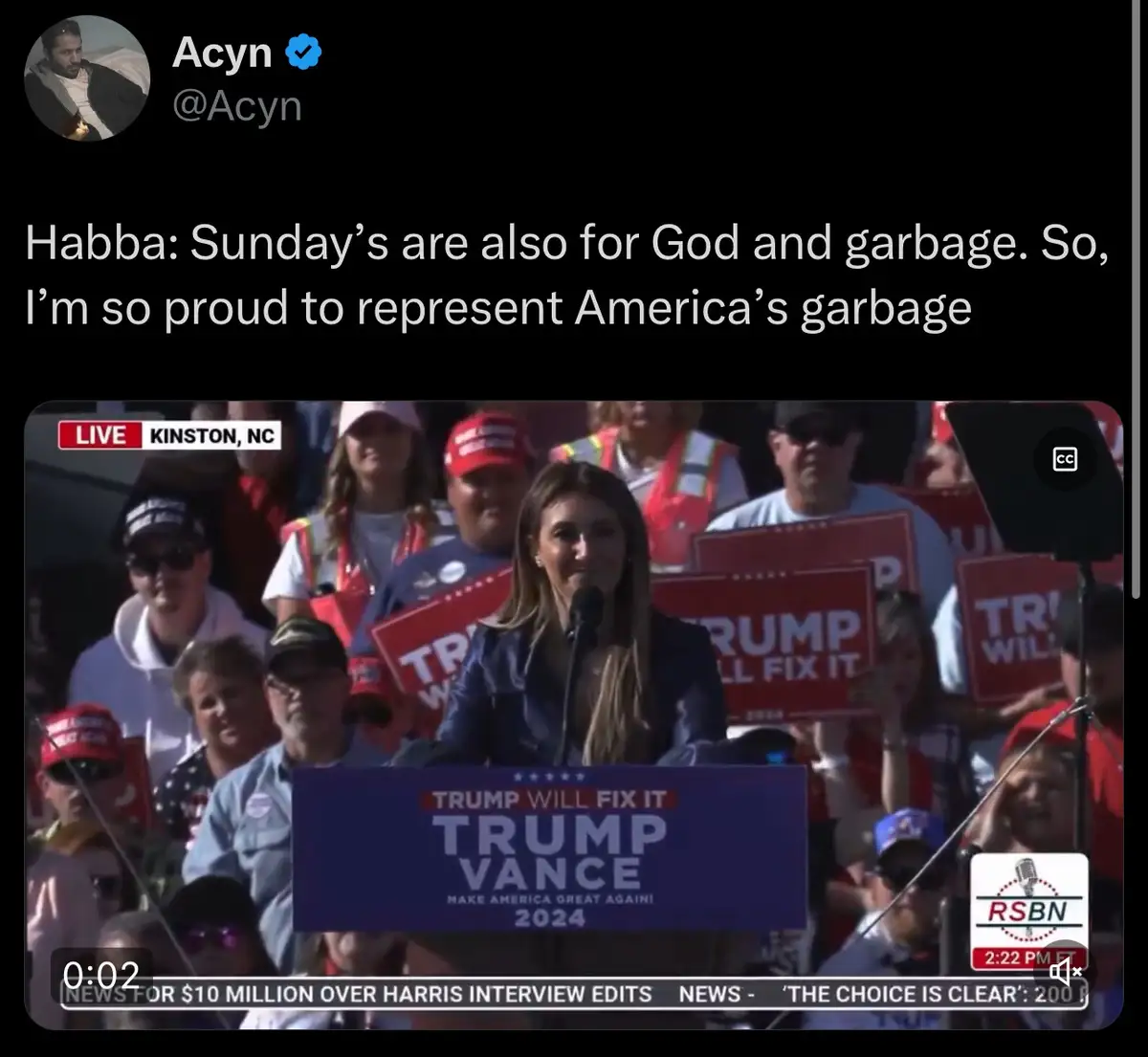 A screenshot of a political rally shows a woman speaking at a podium with 'TRUMP VANCE 2024' and 'TRUMP WILL FIX IT'…