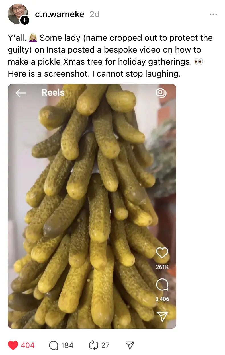 A screenshot of an Instagram Reels post showing a pyramid-shaped arrangement of dill pickles, resembling a Christmas tree…