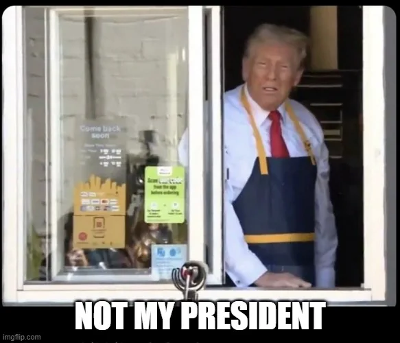 A man resembling Donald Trump, wearing a blue and yellow apron over a white shirt and red tie, leans out of a fast-food…