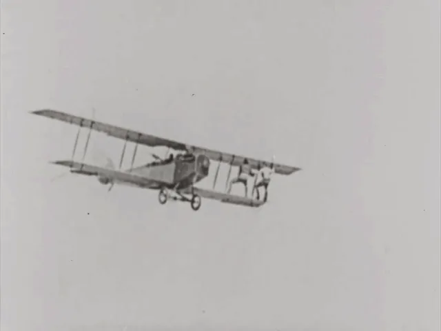 A black-and-white sequence of six photos shows a biplane in flight with a man hanging from its side. In the first three…
