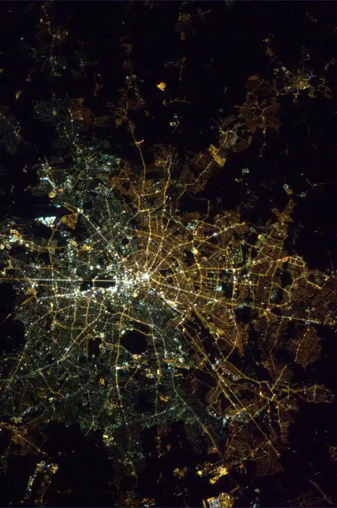 The visible divide of East and West Berlin: a unique perspective from space with contrasting street lights