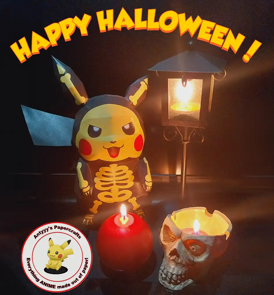 A paper craft Pikachu wearing a skeleton costume stands beside a lit lantern and two candles, one in a red holder and one in…