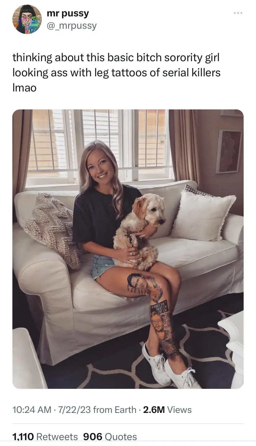 A blonde woman sits on a white couch holding a small dog, smiling at the camera. Her left leg is prominently displayed…