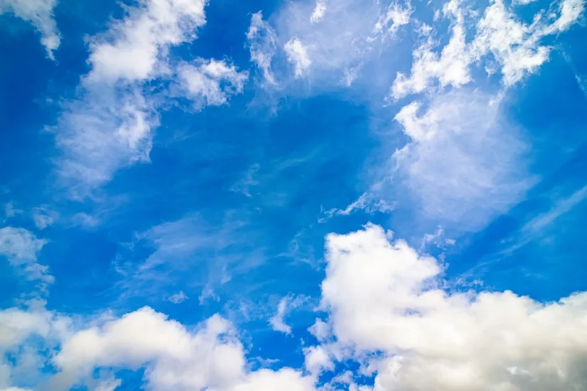 A bright blue sky with scattered white clouds, overlaid with the text 'i'm not crying, you're crying' in a bold, black…