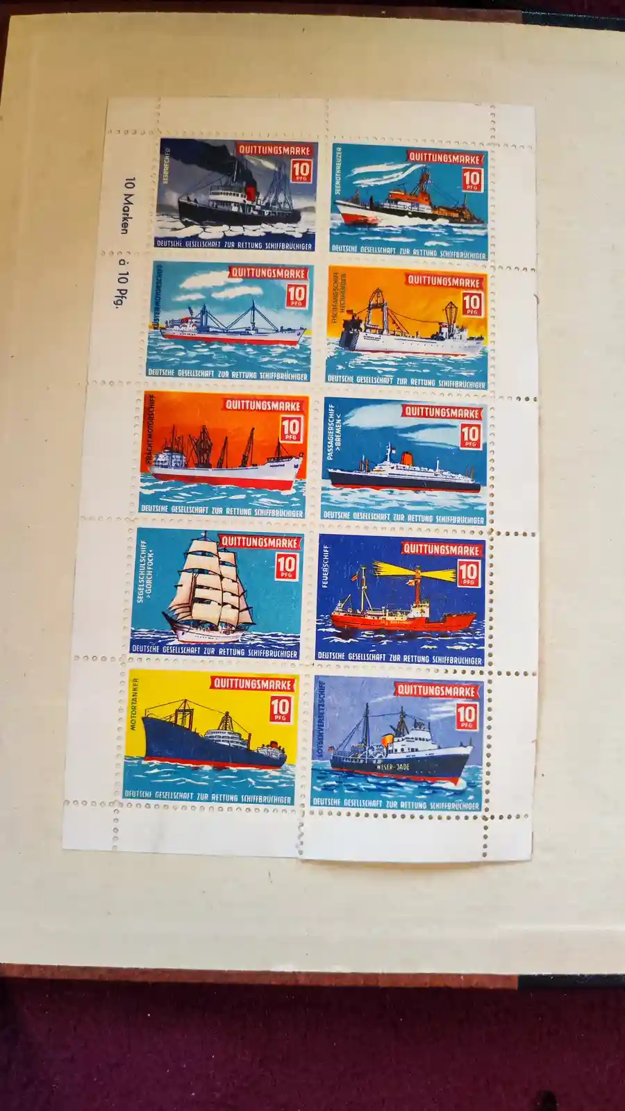 A sheet of eight vintage German postage stamps, each depicting a different type of ship like icebreakers, cargo vessels, and…