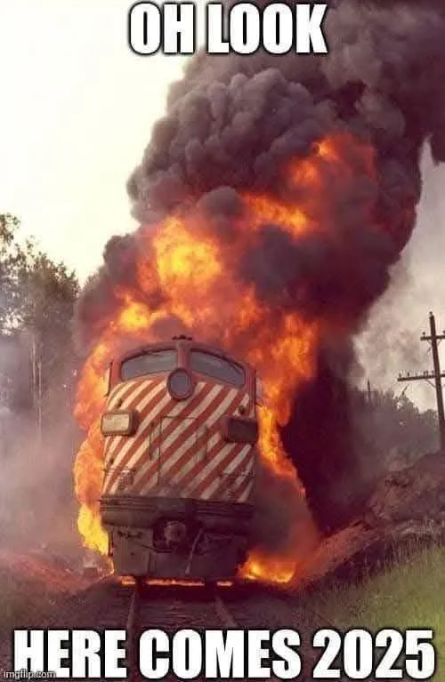A train is engulfed in flames and thick black smoke, with the overlaid text reading 'OH LOOK' at the top and 'HERE COMES…