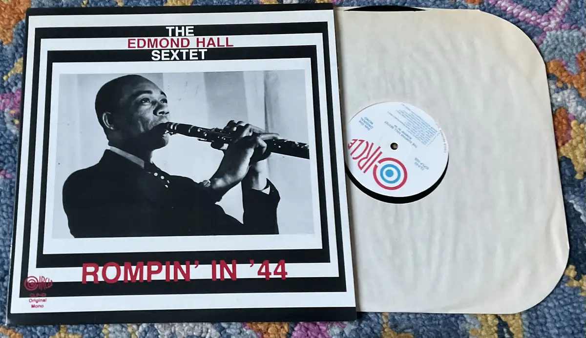 A vintage vinyl record album cover for 'The Edmond Hall Sextet' titled 'Rompin' In '44' is shown open, revealing the record…