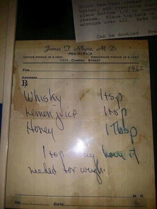 A vintage 1962 pediatrician's prescription pad with handwritten ingredients for a remedy: whisky, lemon juice, and honey…