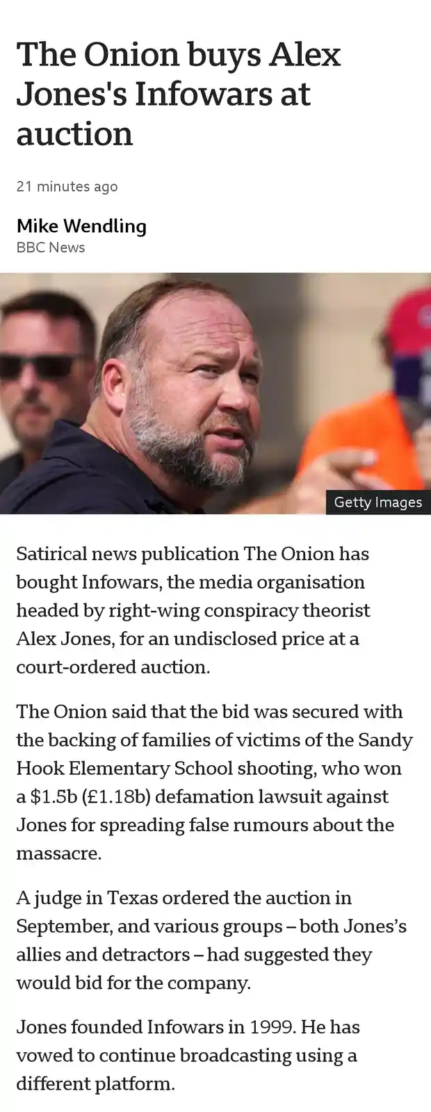 A screenshot of a BBC News article headlined 'The Onion buys Alex Jones's Infowars at auction,' featuring a photo of Alex…