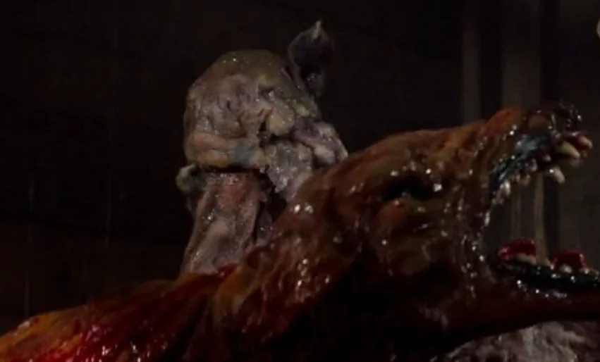 A grotesque, decaying humanoid creature with a mangled, bloodied face and exposed flesh is shown in a dark, grim setting…
