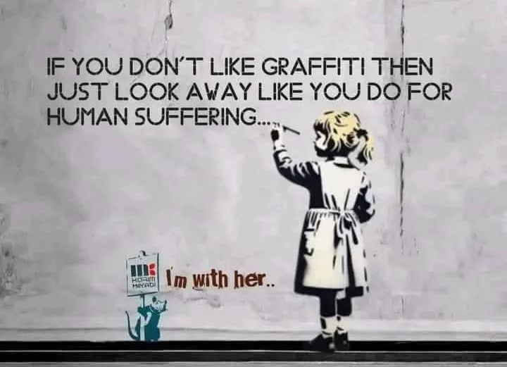 A stencil-style image shows a young girl in a coat painting graffiti on a wall, with a small cat holding a sign that reads…
