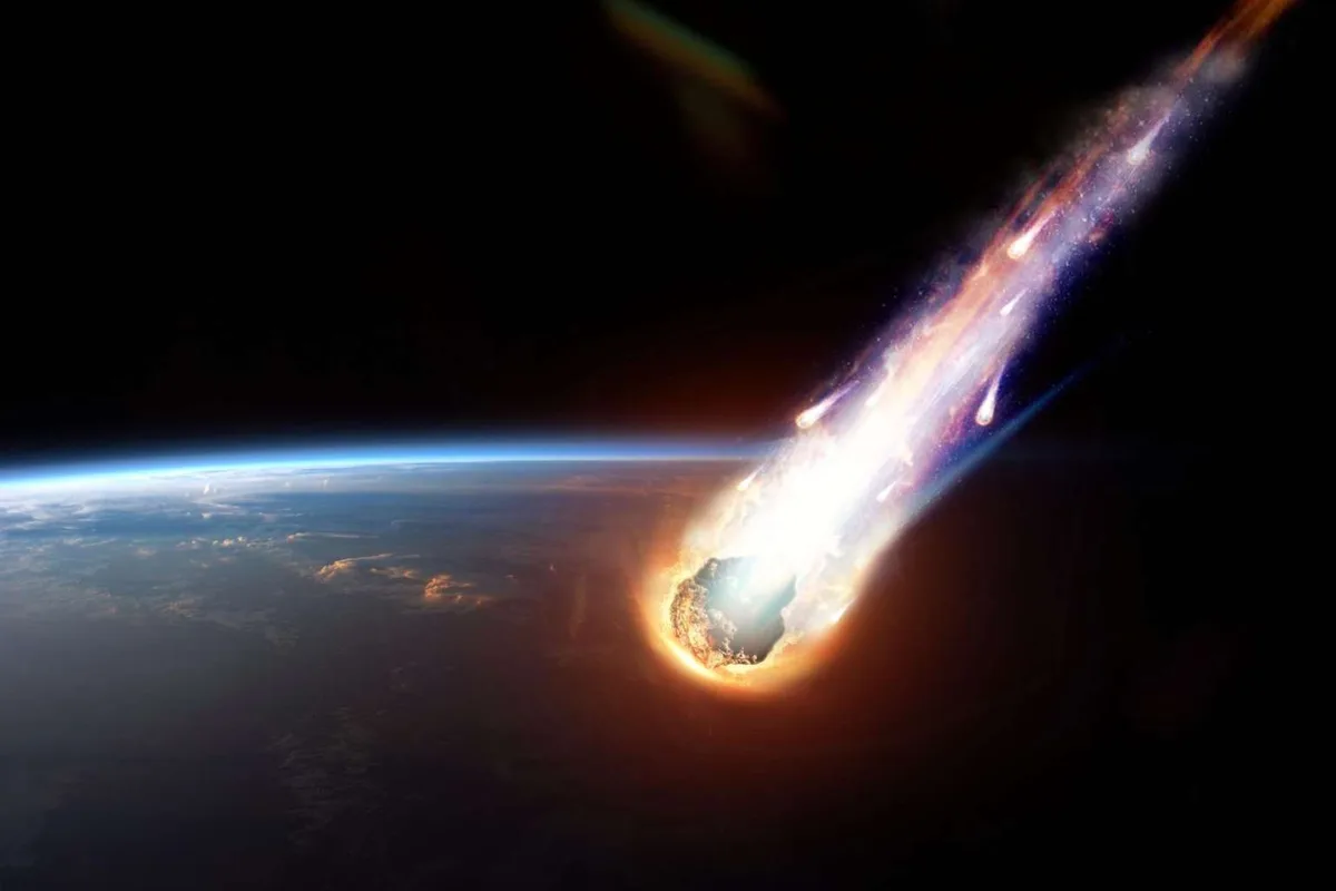 A dramatic space image shows a large, fiery meteor streaking toward Earth, leaving a bright, glowing trail as it approaches…