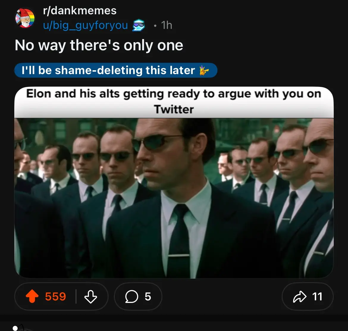 The image shows a scene from the movie 'The Matrix' featuring a group of men in black suits and sunglasses, looking serious…