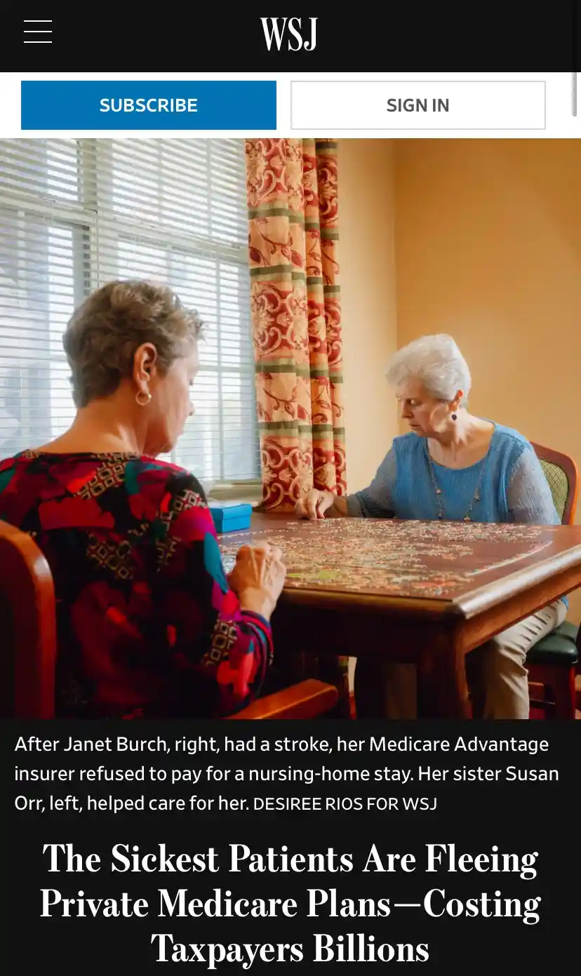Two elderly women are seated at a wooden table, intently working on a large jigsaw puzzle. The image is a screenshot of a…
