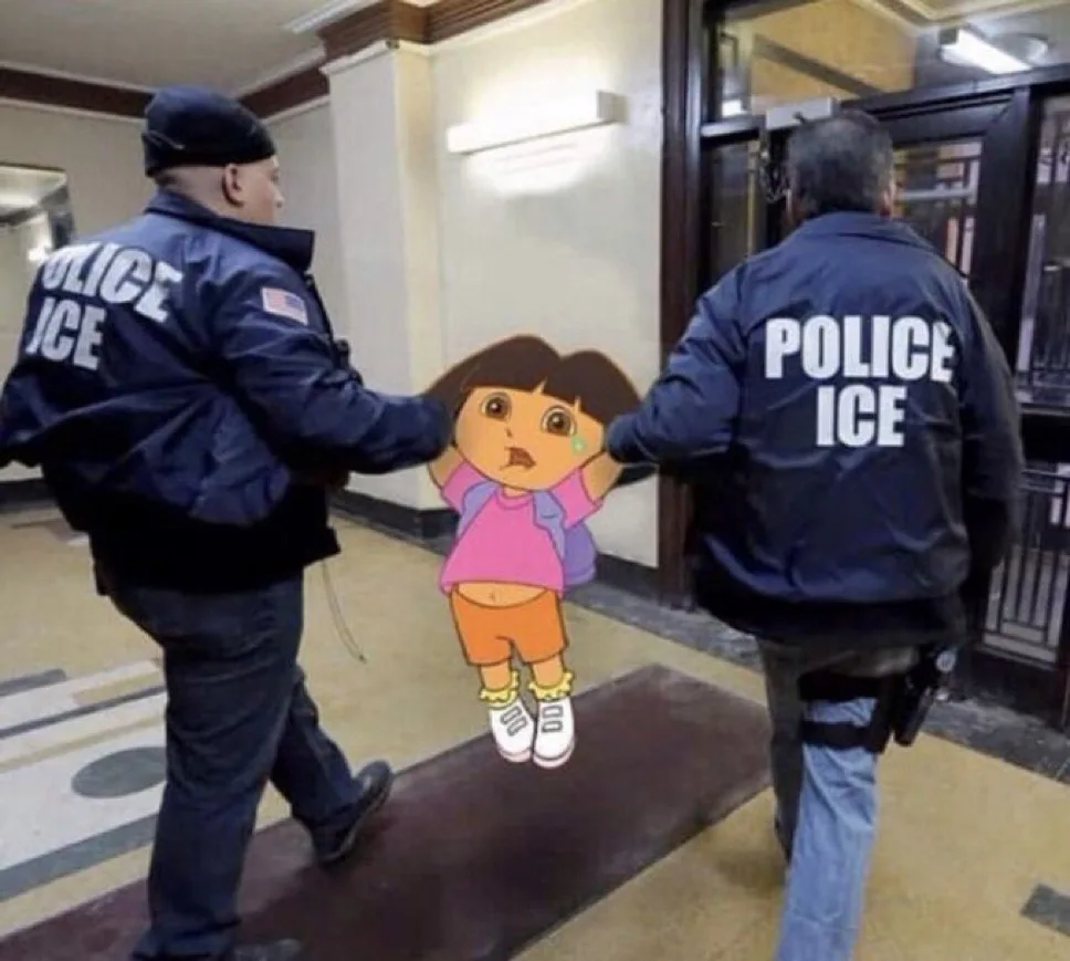 Two real police officers wearing jackets labeled 'POLICE ICE' are shown from behind, each holding an arm of a cartoon cutout…