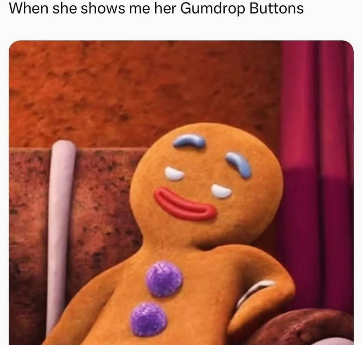 A gingerbread man with a smug, self-satisfied expression sits in a chair, his eyes half-closed and a wide grin on his face…