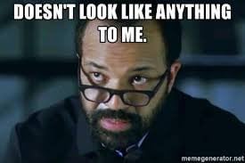 A man with dark-rimmed glasses and a beard stares intently at the viewer with a confused or skeptical expression. The text…