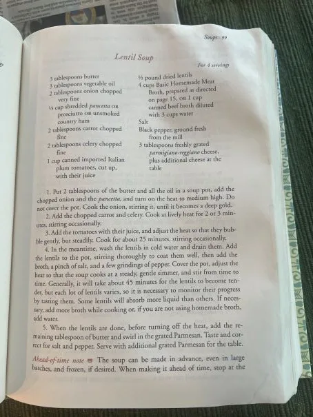 An open cookbook page showing a detailed lentil soup recipe with ingredients and cooking steps. Overlaid text reads 'I'm not…