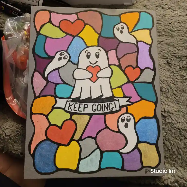 A hand-painted canvas features a cheerful, cartoon-style ghost holding a red heart, surrounded by three other smaller ghosts…